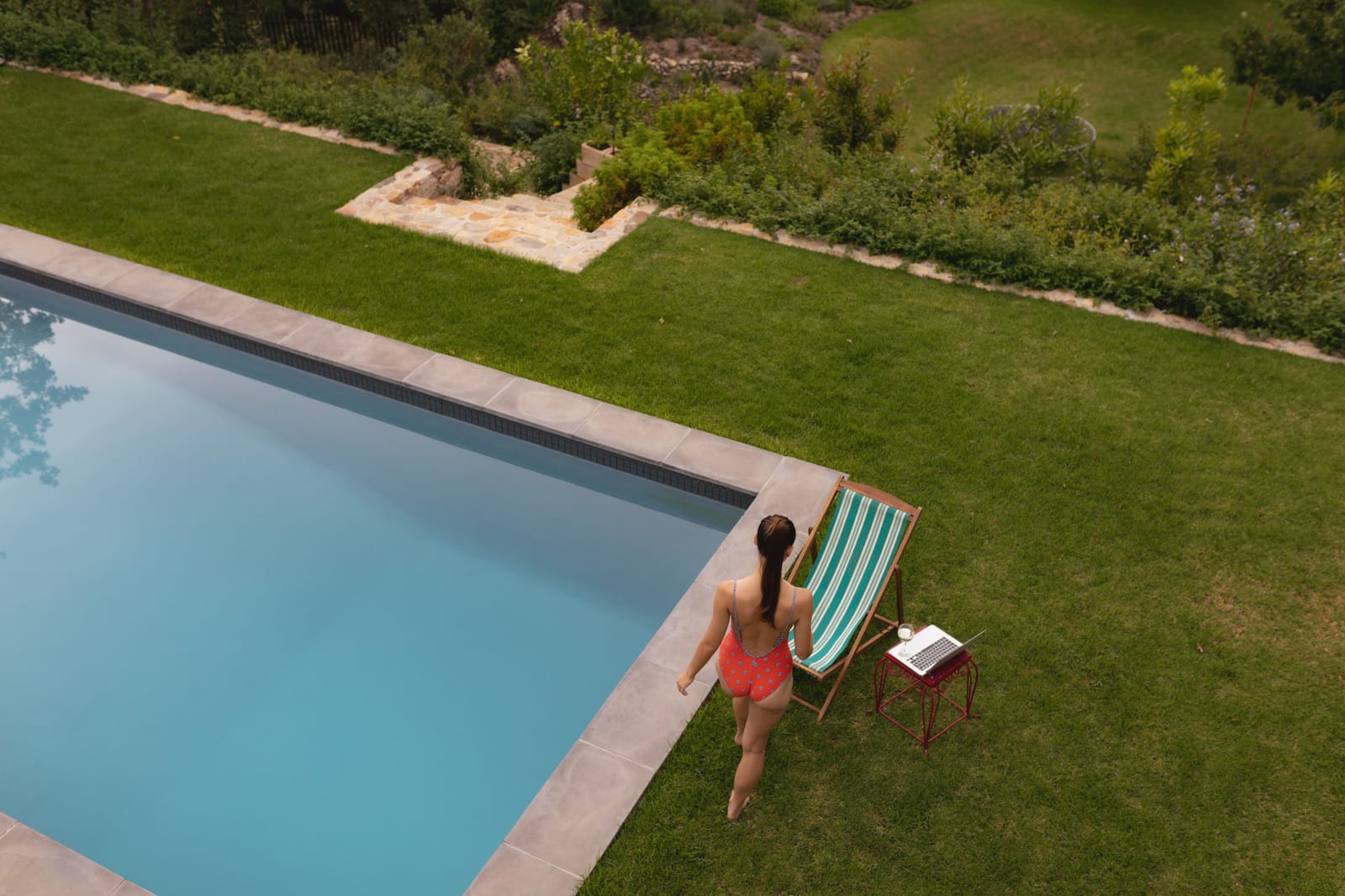 Pool equipment pad with pump and filter during a tune-up visit