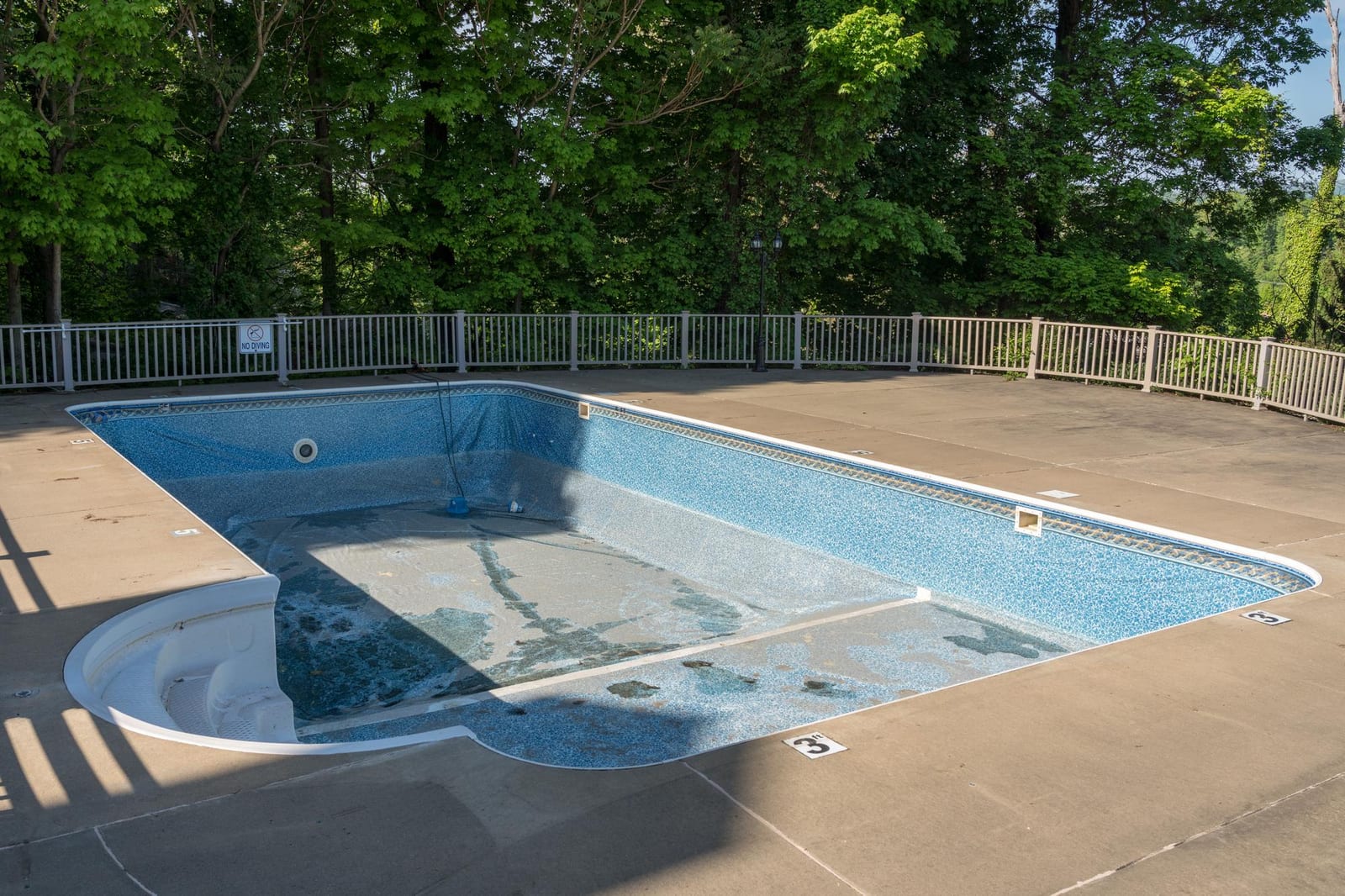 Pool deck and tiled edge after a spring opening visit